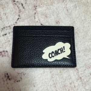 Like new.  Coach Marvel Black Leather Card Holder with White Graphic